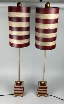 Lot 521 - A PAIR OF RED AND WHITE STRIPED LAMPS, 98cm h...