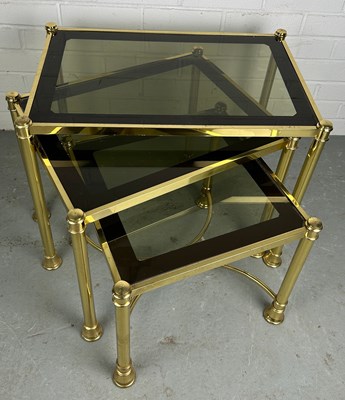 Lot 539 - A NEST OF THREE HOLLYWOOD REGENCY STYLE BRASS...