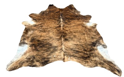 Lot 556 - A LARGE COW HIDE RUG,

190cm x 180cm