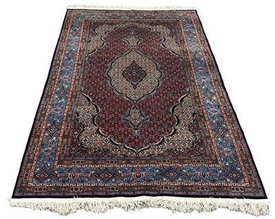 Lot 560 - A LARGE AND FINE PERSIAN DESIGN CARPET, 

In...