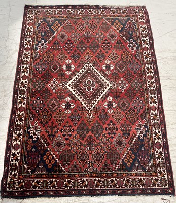 Lot 730 - A PERSIAN DESIGN CARPET