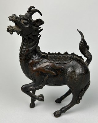 Lot 9 - A CHINESE BRONZE FIGURE OF A MYTHICAL ANIMAL,...