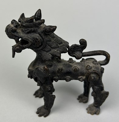 Lot 11 - A CHINESE BRONZE FIGURE OF A LION,

9cm x 9cm