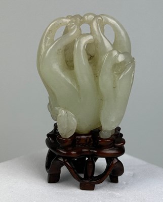 Lot 33 - A 19TH CENTURY CHINESE WHITE JADE CARVING OF A...