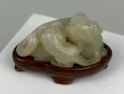 Lot 34 - A 19TH CENTURY CHINESE JADE GROUP OF A LION...