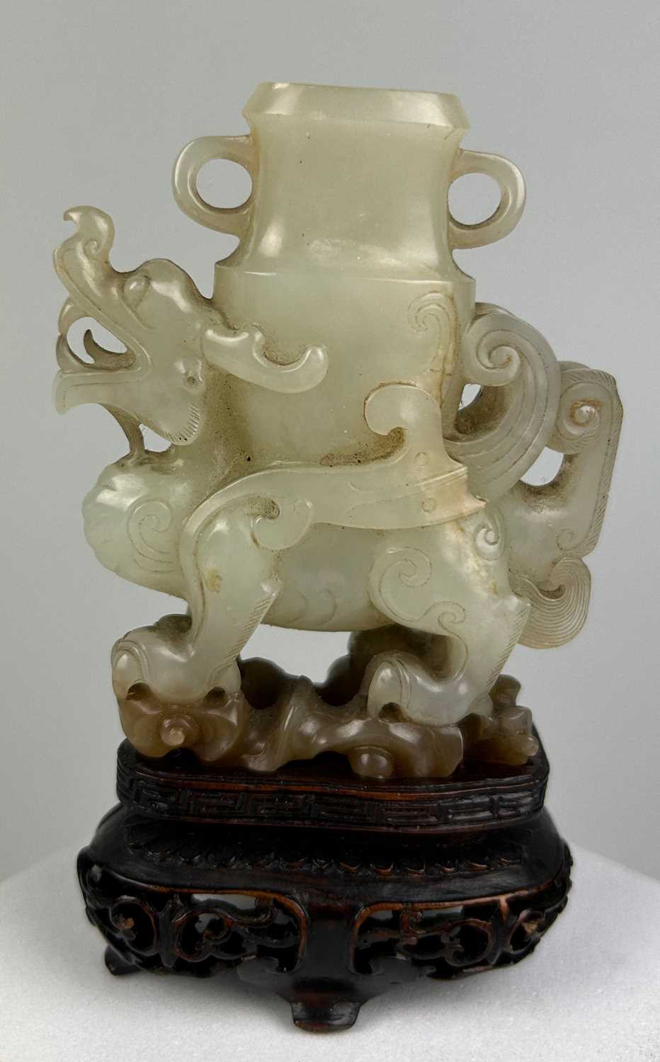 Lot 36 - AN 18TH CENTURY CHINESE JADE WINGED DRAGON...