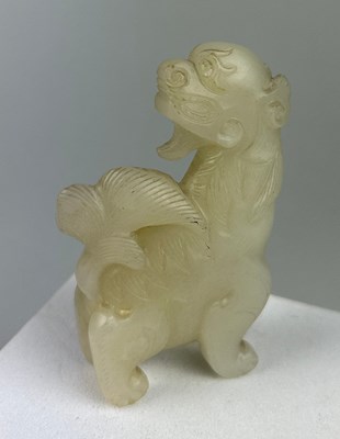 Lot 37 - AN EARLY 19TH CENTURY CHINESE WHITE JADE GROUP...