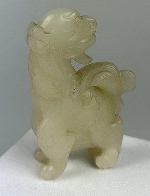 Lot 37 - AN EARLY 19TH CENTURY CHINESE WHITE JADE GROUP...