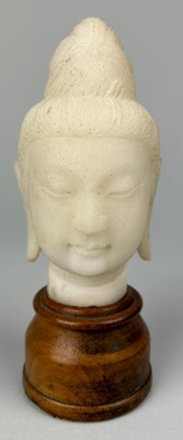 Lot 85 - A CHINESE MARBLE HEAD OF A GUANYIN ON...