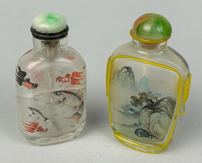 Lot 108 - TWO GLASS SNUFF BOTTLES DECORATED WITH FISH...