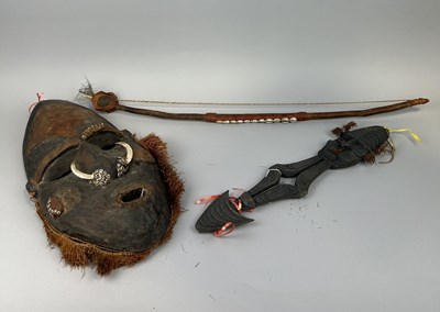 Lot 597 - A TRIBAL MASK ALONG WITH A WOODEN FIGURE AND MUSICAL INSTRUMENT (3)