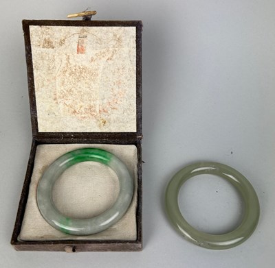 Lot 38 - TWO CHINESE JADEITE AND JADE BANGLES (2),...