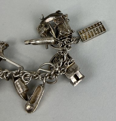 Lot 187 - TWO CHINESE SILVER CHARM BRACELETS