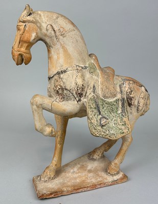 Lot 66 - A CHINESE POTTERY HORSE FIGURE IN THE TANG...