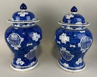 Lot 102 - A PAIR OF CHINESE PRUNUS JARS AND COVERS,...