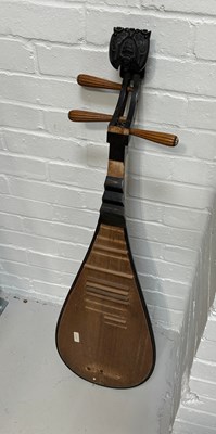 Lot 107 - A CHINESE HARDWOOD LUTE WITH CARVED SCROLL IN...