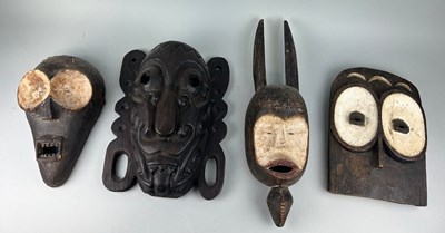 Lot 120 - A GROUP OF FOUR AFRICAN TRIBAL MASKS (4),...