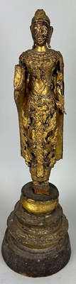 Lot 122 - A CARVED GILT WOOD CARVED FIGURE OF A BUDDHA,...