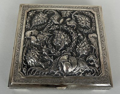 Lot 154 - AN ANTIQUE PERSIAN SILVER BOX HAND CHASED...