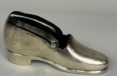 Lot 159 - A SILVER BOOT PIN CUSHION