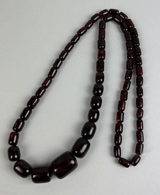 Lot 189 - A CHERRY AMBER GRADUATED BEAD NECKLACE