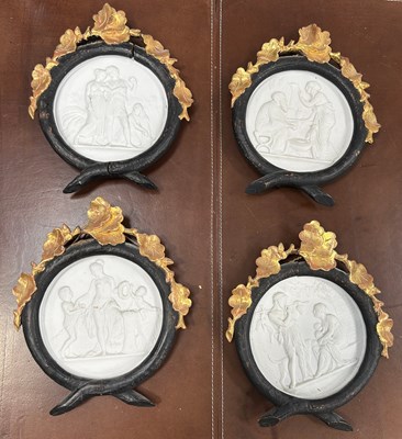 Lot 34 - A SET OF FOUR EUROPEAN CERAMIC PLAQUES IN...