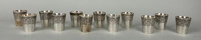 Lot 124 - A SET OF TWELVE PERSIAN SILVER SILVER SHOT...