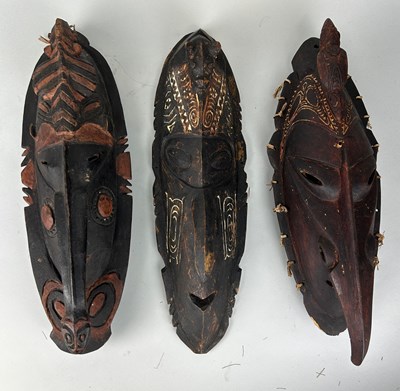 Lot 199 - A GROUP OF THREE OCEANIC PAINTED WOODEN MASKS,...