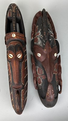 Lot 200 - TWO CARVED OCEANIC PAINTED WOODEN MASKS WITH...