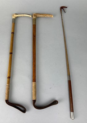 Lot 212 - A PAIR OF RIDING CROPS WITH HORN HANDLES ALONG...