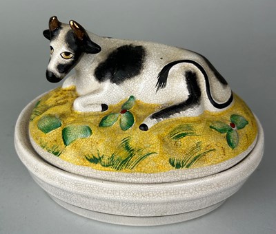 Lot 256 - A CERAMIC 'COW' DISH AND LID,
 
17cm x 13cm