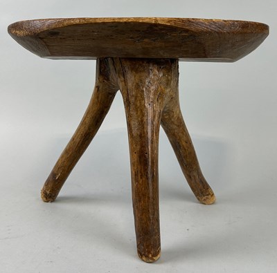 Lot 425 - A PRIMITIVE OAK MILKING STOOL ON THREE LEGS,...