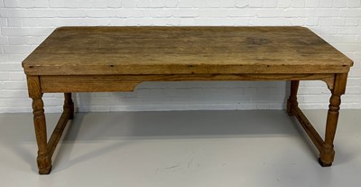 Lot 510 - A LARGE PINE FARMHOUSE TABLE WITH PLANK TOP,...