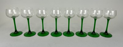 Lot 521 - A SET OF EIGHT WINE GLASSES WITH GREEN STEMS,...