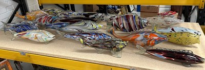 Lot 565 - A COLLECTION OF TWENTY LARGE GLASS FISH,...