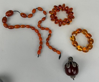 Lot 602 - A COLLECTION OF AMBER COLOURED BEADS