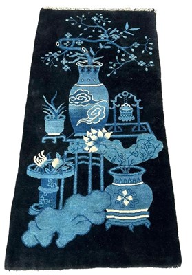 Lot 615 - A 20TH CENTURY CHINESE RUG, 

148cm x 73cm