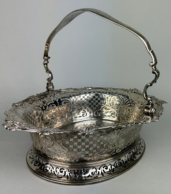 Lot 1 - A GEORGE II SILVER CAKE BASKET, Marked for...