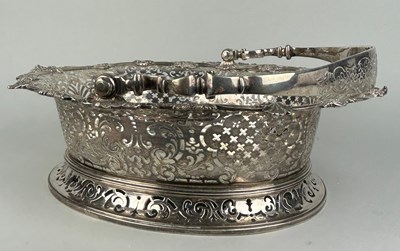 Lot 1 - A GEORGE II SILVER CAKE BASKET, Marked for...