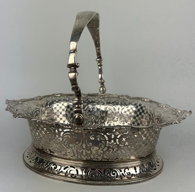 Lot 1 - A GEORGE II SILVER CAKE BASKET, Marked for...