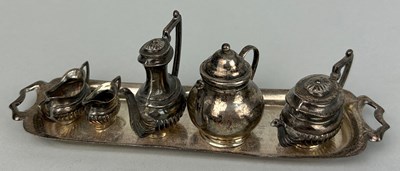 Lot 13 - A MINIATURE SILVER TEA SET, 

Comprising a...