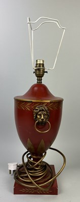 Lot 983 - A RED REGENCY STYLE TOLEWARE TABLE LAMP WITH LION HEAD HANDLES