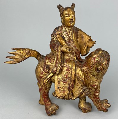 Lot 118 - A CHINESE RED LACQUERED AND GILT WOOD FIGURE...