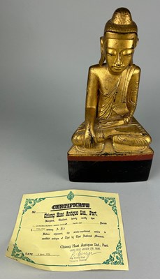 Lot 119 - A BURMESE SEATED FIGURE OF THE BUDDHA, 

With...